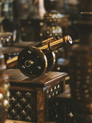 Antique metal cannon showcased in an elegant indoor setting highlighting craftsmanship and traditional decor.