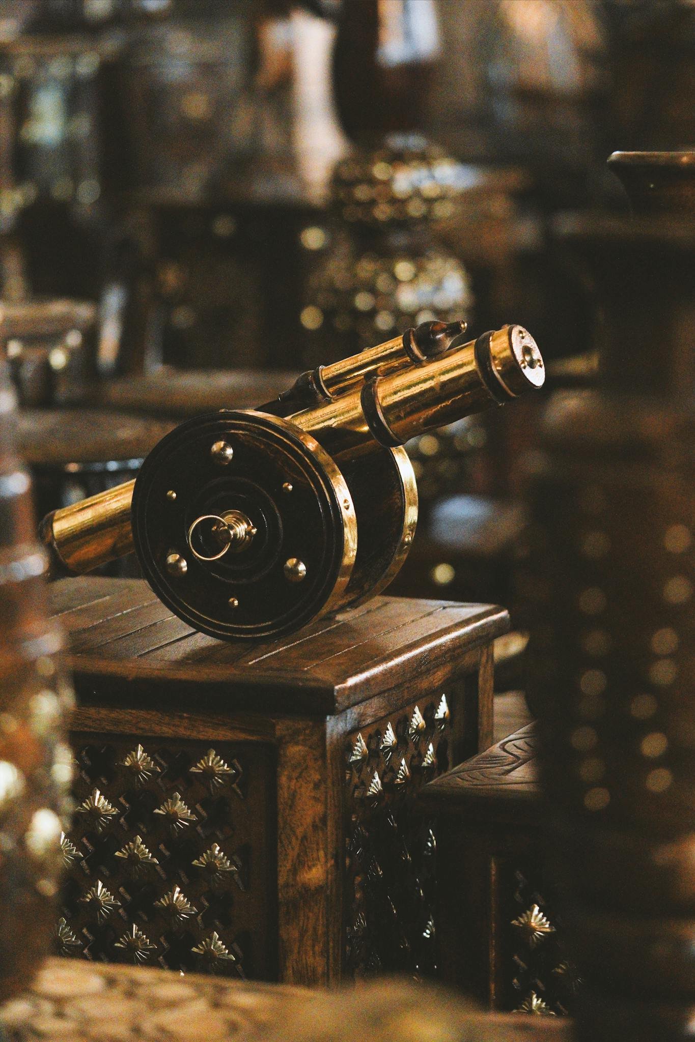 Antique metal cannon showcased in an elegant indoor setting highlighting craftsmanship and traditional decor.