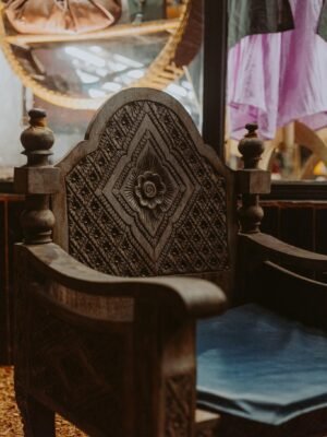 Beautifully carved wooden armchair showcasing vintage design indoors.