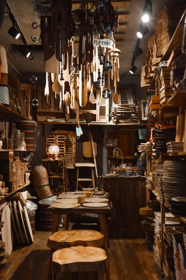 Cozy rustic interior of a wooden craft shop showcasing handcrafted items and retail display.
